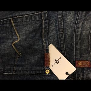 7For All Mankind dark wash lightly distressed boot